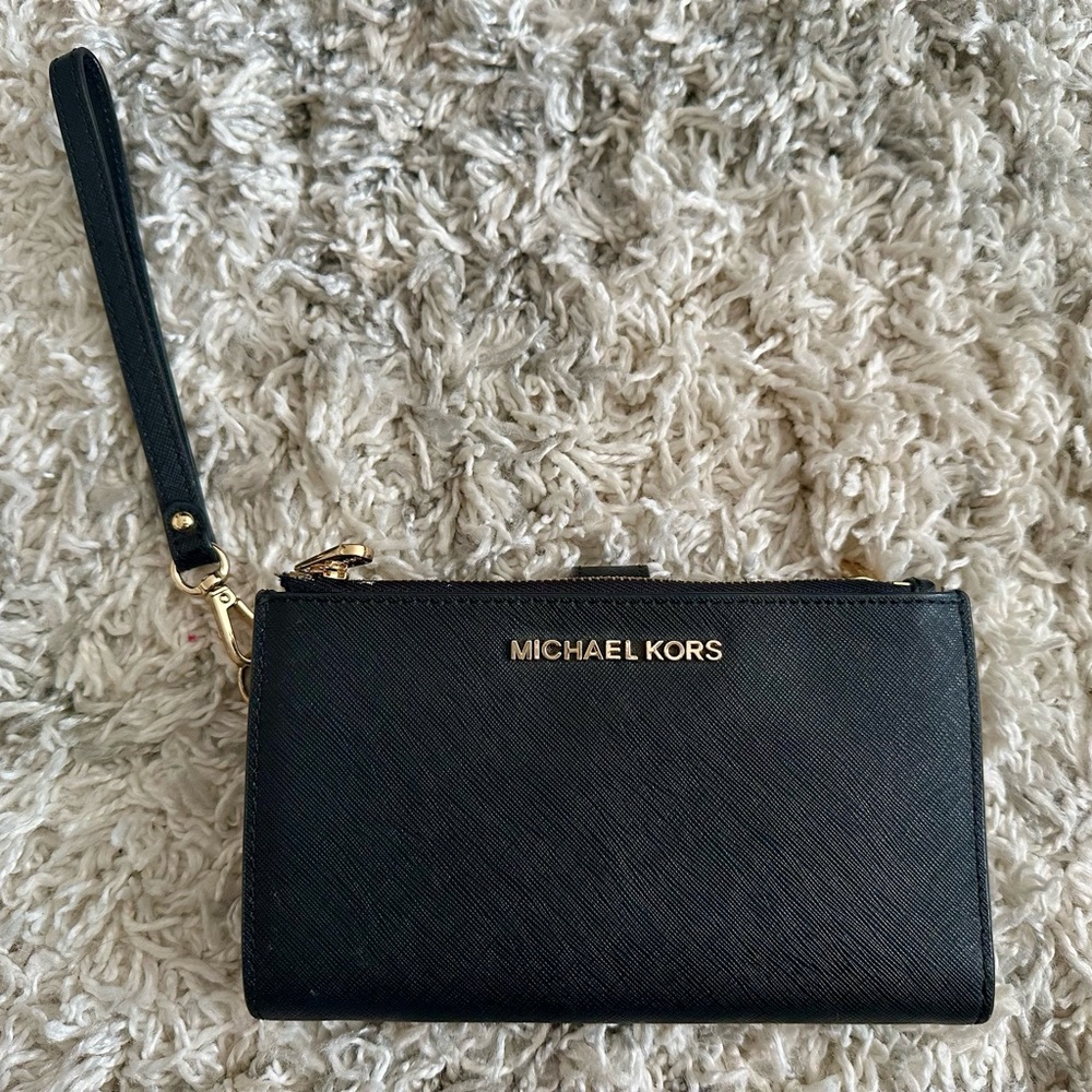 Used Michael Kors Black Saffiano leather wallet/wristlet 
*smoke & pet free home